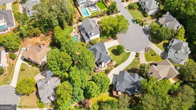 aerial perspective of suburban area with a pool