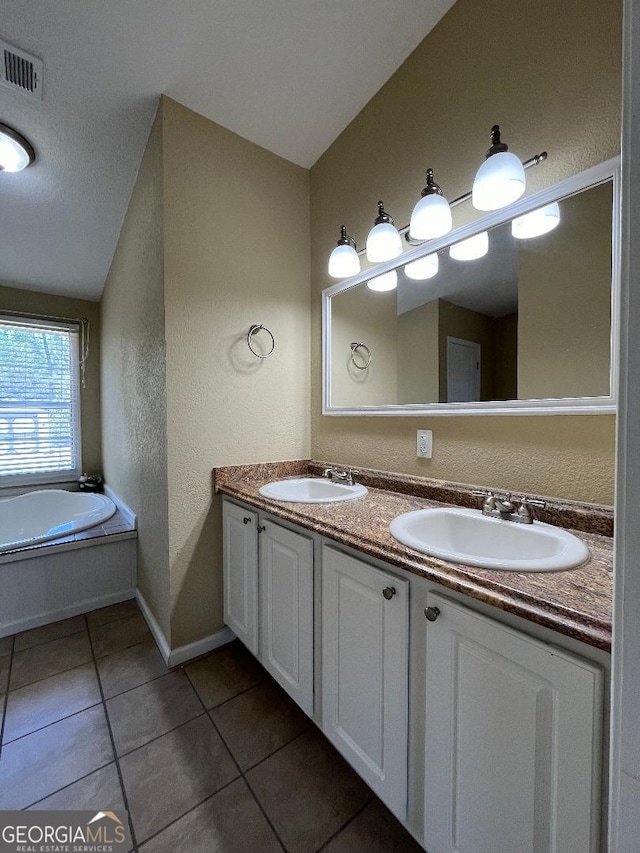 1640 Hg Miles Dr NE, Townsend, GA 31331 - bathroom with tile patterned floors, a sink, visible vents, and double vanity