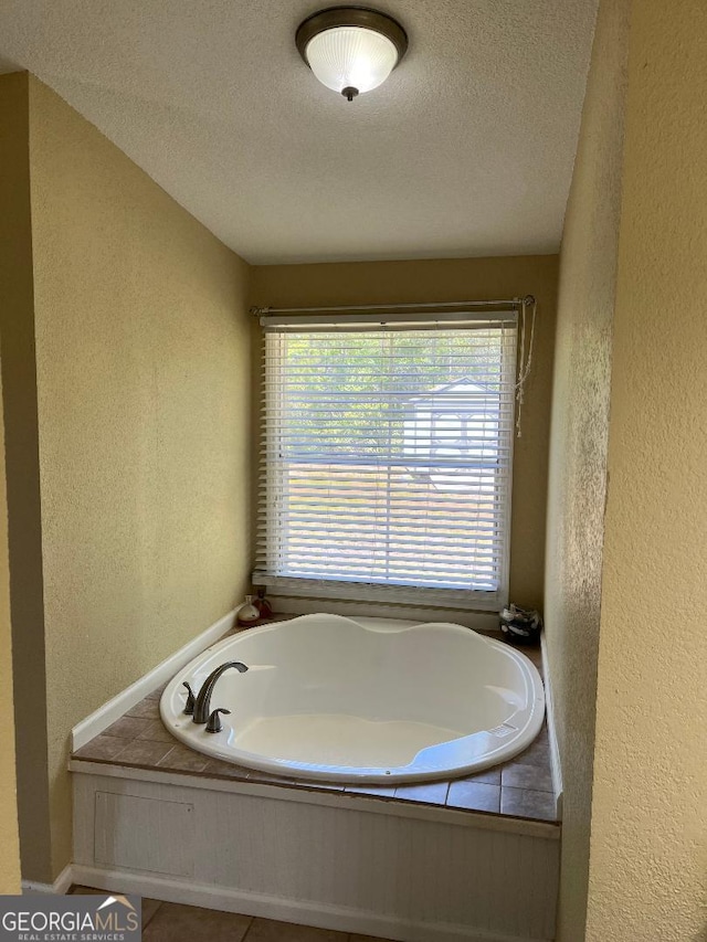 1640 Hg Miles Dr NE, Townsend, GA 31331 - full bathroom featuring a garden tub, a textured wall, and a textured ceiling