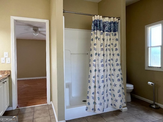 1640 Hg Miles Dr NE, Townsend, GA 31331 - bathroom featuring tile patterned floors, toilet, vanity, a shower with shower curtain, and ceiling fan