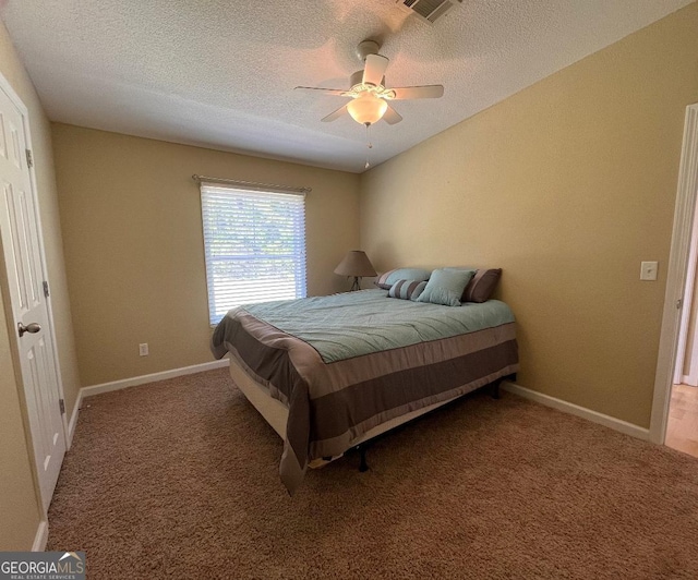 1640 Hg Miles Dr NE, Townsend, GA 31331 - carpeted bedroom with baseboards, a ceiling fan, a textured ceiling, and visible vents