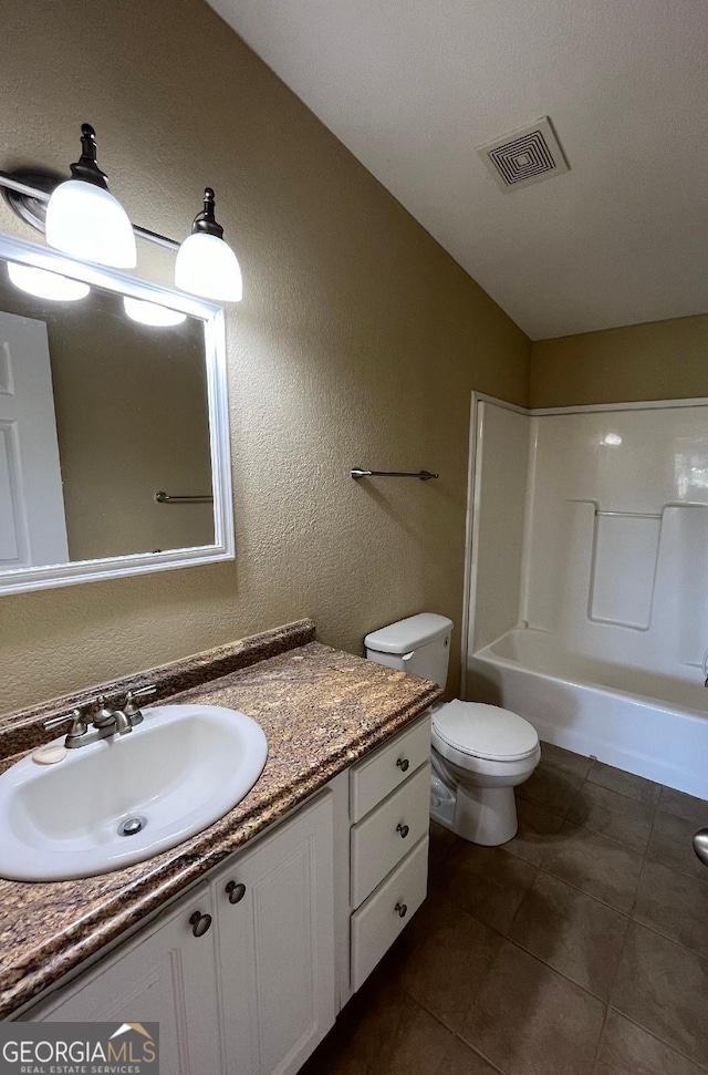 1640 Hg Miles Dr NE, Townsend, GA 31331 - full bath with toilet, bathtub / shower combination, visible vents, tile patterned flooring, and vanity