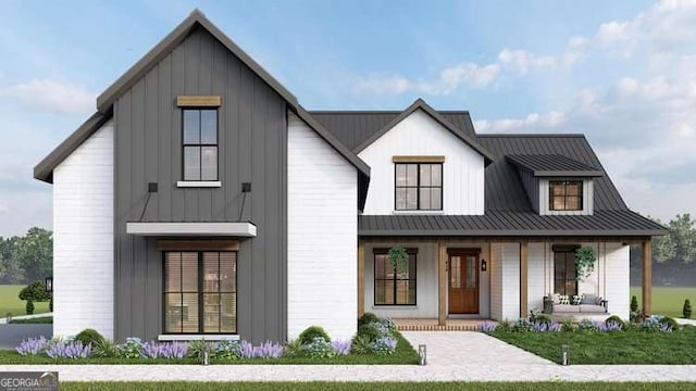 1250 Hayes Mill Rd, Carrollton, GA 30117 - modern farmhouse with a porch, board and batten siding, a metal roof, and a front yard