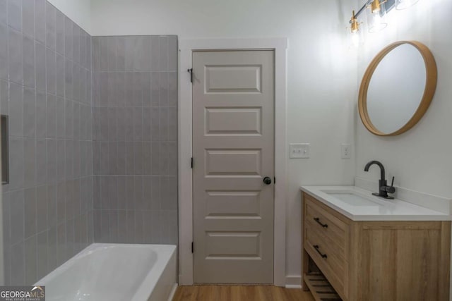 1250 Hayes Mill Rd, Carrollton, GA 30117 - full bath featuring vanity, wood finished floors, and shower / tub combination