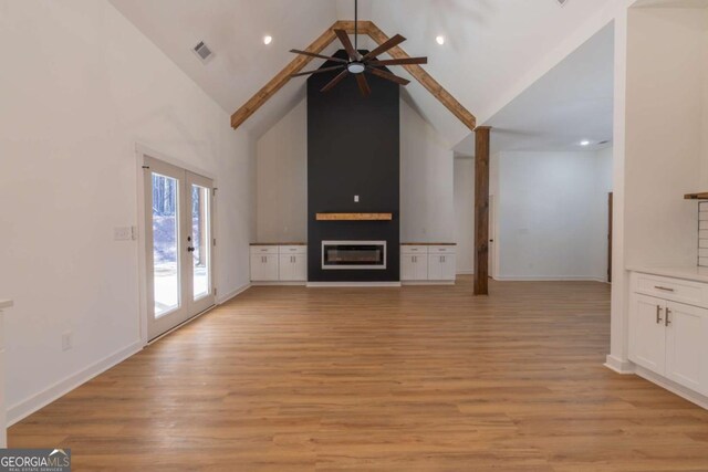 1250 Hayes Mill Rd, Carrollton, GA 30117 - unfurnished living room with ceiling fan, high vaulted ceiling, light wood-style flooring, a fireplace, and recessed lighting
