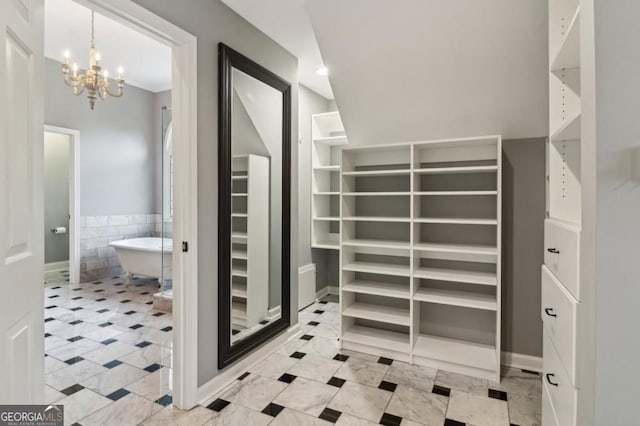 3115 Corsair Curv, Cumming, GA 30040 - spacious closet featuring a chandelier