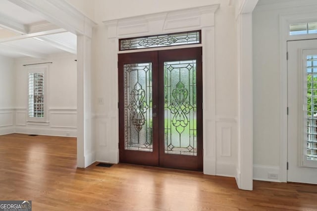 3115 Corsair Curv, Cumming, GA 30040 - foyer with french doors, wood finished floors, beamed ceiling, a decorative wall, and wainscoting