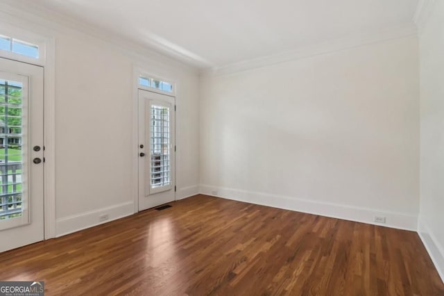 3115 Corsair Curv, Cumming, GA 30040 - foyer entrance with crown molding, wood finished floors, and baseboards