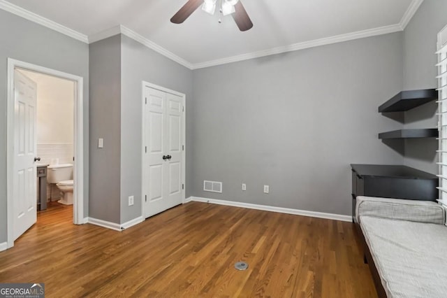 3115 Corsair Curv, Cumming, GA 30040 - unfurnished bedroom featuring wood finished floors, ornamental molding, baseboards, a ceiling fan, and connected bathroom