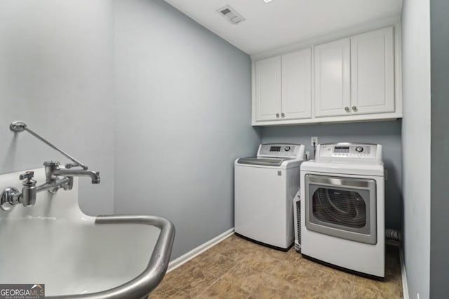 3115 Corsair Curv, Cumming, GA 30040 - laundry room with cabinet space, washer and clothes dryer, and baseboards
