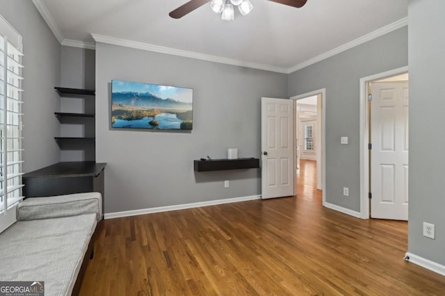 3115 Corsair Curv, Cumming, GA 30040 - unfurnished living room with ceiling fan, wood finished floors, crown molding, and baseboards
