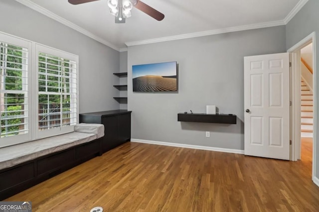 3115 Corsair Curv, Cumming, GA 30040 - unfurnished room featuring wood finished floors, a ceiling fan, ornamental molding, baseboards, and stairs