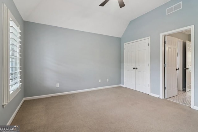 3115 Corsair Curv, Cumming, GA 30040 - unfurnished bedroom with carpet flooring, lofted ceiling, baseboards, a closet, and a ceiling fan