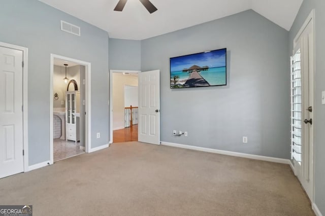 3115 Corsair Curv, Cumming, GA 30040 - unfurnished bedroom featuring carpet, baseboards, connected bathroom, lofted ceiling, and ceiling fan