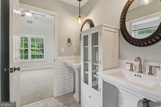3115 Corsair Curv, Cumming, GA 30040 - bathroom featuring tile walls, ceiling fan, a sink, and wainscoting