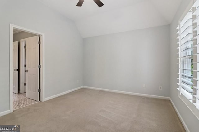 3115 Corsair Curv, Cumming, GA 30040 - spare room with carpet, a ceiling fan, lofted ceiling, and baseboards