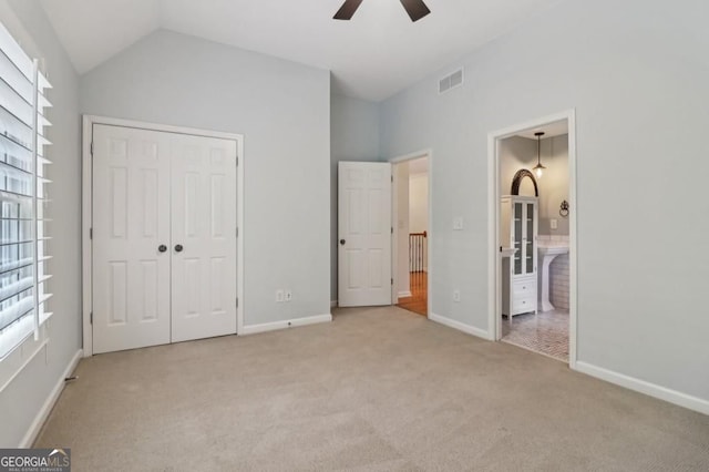 3115 Corsair Curv, Cumming, GA 30040 - unfurnished bedroom with carpet, lofted ceiling, a closet, baseboards, and a ceiling fan