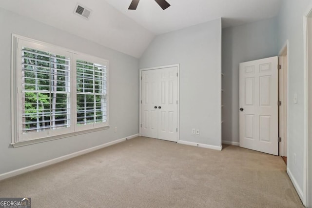 3115 Corsair Curv, Cumming, GA 30040 - unfurnished bedroom with light colored carpet, baseboards, lofted ceiling, ceiling fan, and a closet