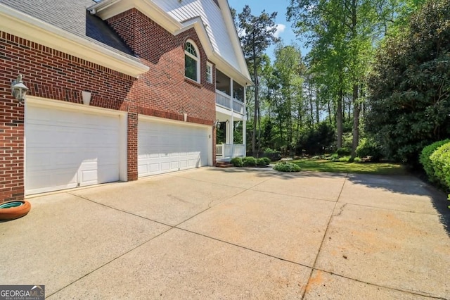 3115 Corsair Curv, Cumming, GA 30040 - view of side of property with brick siding, driveway, and a garage