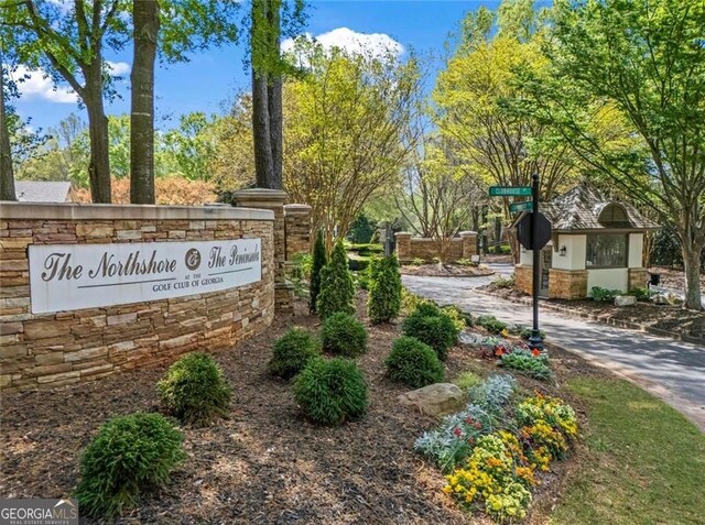 2120 Blackheath Trce, Alpharetta, GA 30005 - kitchen featuring wall chimney range hood, stainless steel built in fridge, crown molding, arched walkways, and decorative backsplash