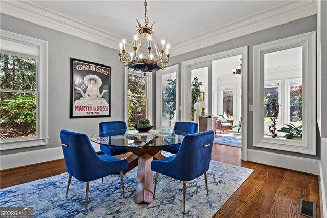 2120 Blackheath Trce, Alpharetta, GA 30005 - dining room with a chandelier, wood finished floors, and crown molding