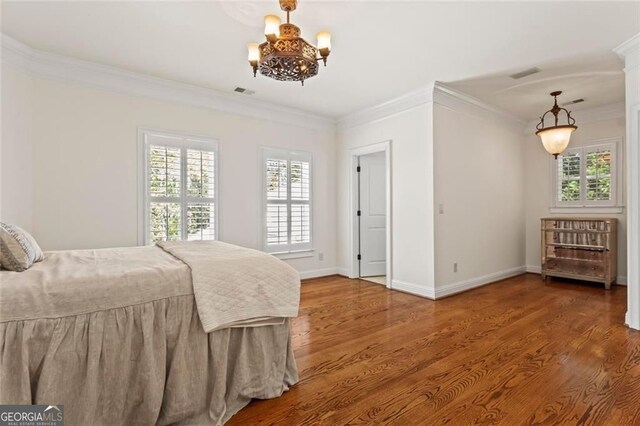 2120 Blackheath Trce, Alpharetta, GA 30005 - bedroom with a chandelier, ornamental molding, and wood finished floors