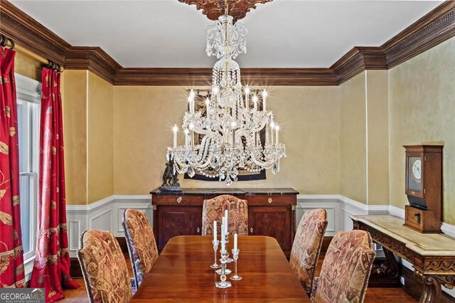 2120 Blackheath Trce, Alpharetta, GA 30005 - dining room featuring a chandelier, ornamental molding, a decorative wall, wainscoting, and wood finished floors