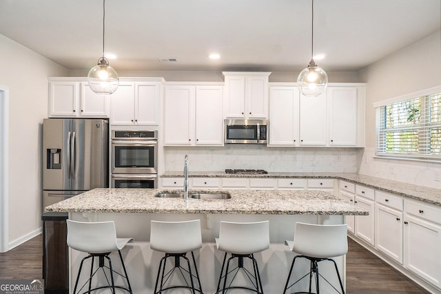 810 Relic Rdg, Hampton, GA 30228 - kitchen with decorative backsplash, stainless steel appliances, white cabinets, and a sink