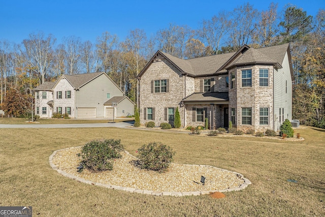 810 Relic Rdg, Hampton, GA 30228 - traditional home featuring brick siding, a front yard, and central AC unit