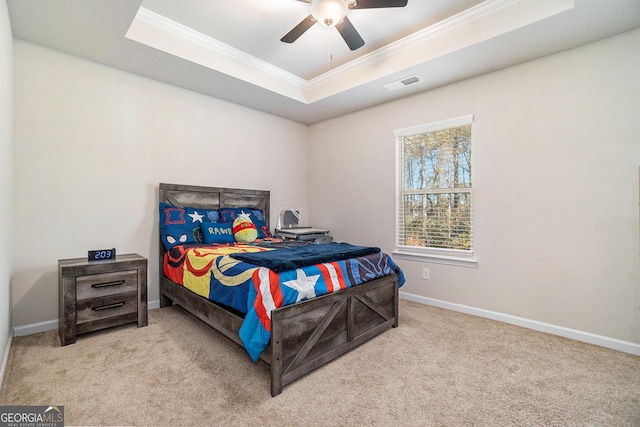 810 Relic Rdg, Hampton, GA 30228 - carpeted bedroom with a tray ceiling, visible vents, crown molding, and baseboards