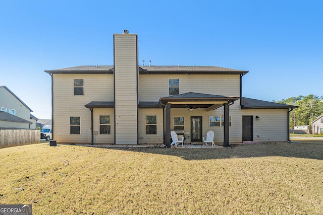 810 Relic Rdg, Hampton, GA 30228 - rear view of house with a patio area, a ceiling fan, a chimney, and a yard