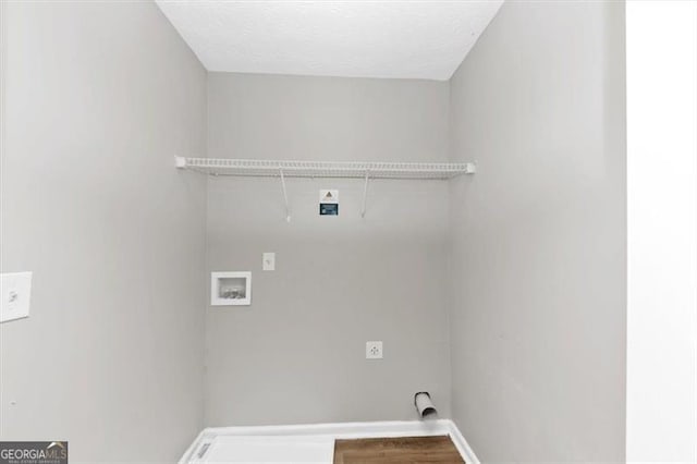 laundry room featuring laundry area, wood finished floors, baseboards, electric dryer hookup, and washer hookup
