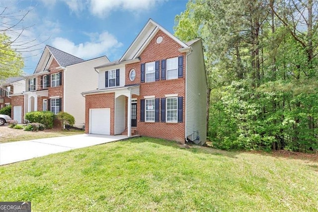 traditional-style house with concrete driveway, an attached garage, brick siding, and a front lawn