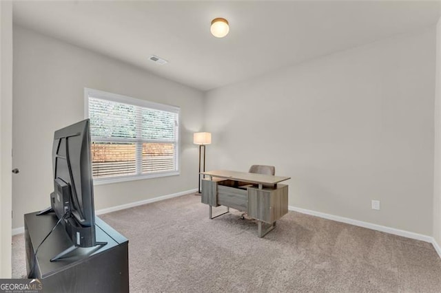 office with carpet floors, visible vents, and baseboards
