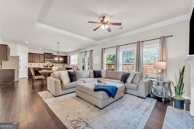 living room with a ceiling fan, crown molding, dark wood-style floors, and recessed lighting