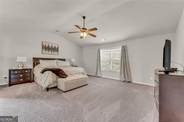 carpeted bedroom with lofted ceiling, baseboards, ceiling fan, and visible vents