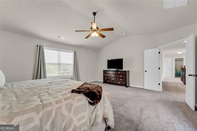 carpeted bedroom with ceiling fan, vaulted ceiling, visible vents, and baseboards