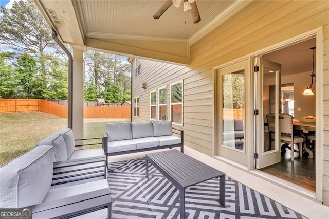 view of patio / terrace with a fenced backyard, an outdoor living space, and ceiling fan