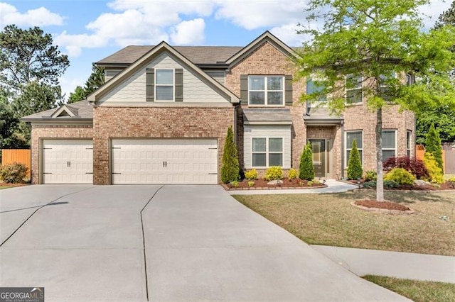 view of front of home featuring fence, a front lawn, an attached garage, driveway, and brick siding