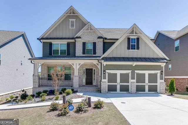7208 Whitewater Dr, Flowery Branch, GA 30542 - craftsman house with board and batten siding, a porch, a standing seam roof, driveway, and a garage
