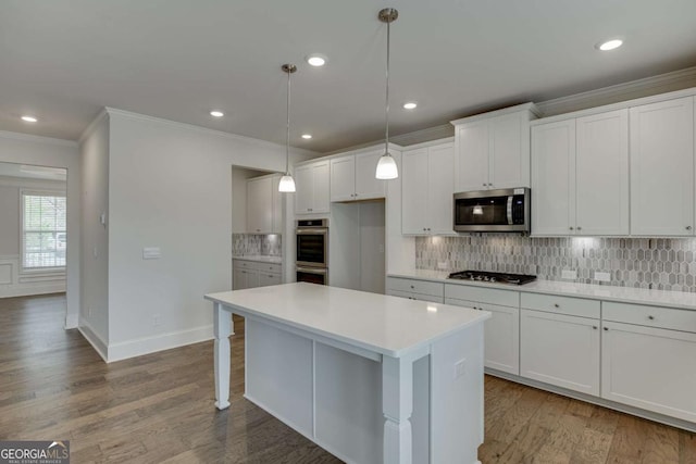 7208 Whitewater Dr, Flowery Branch, GA 30542 - kitchen featuring stainless steel appliances, ornamental molding, decorative backsplash, light countertops, and white cabinetry