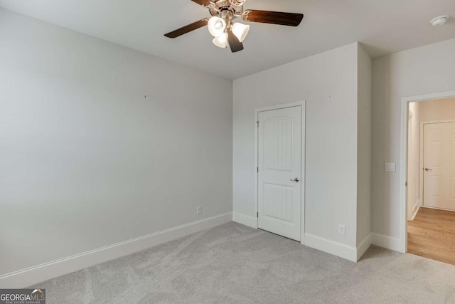 7208 Whitewater Dr, Flowery Branch, GA 30542 - unfurnished bedroom with carpet floors and a ceiling fan