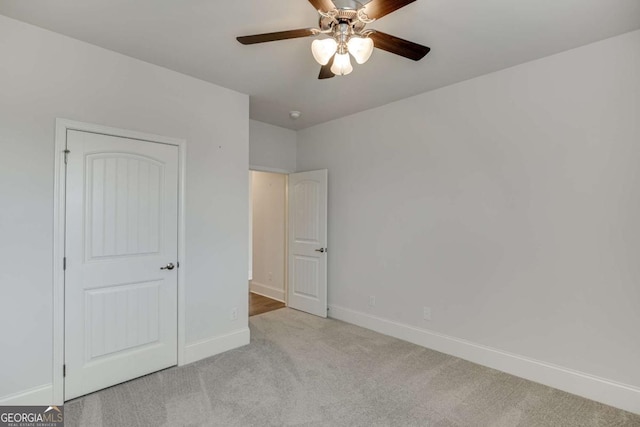 7208 Whitewater Dr, Flowery Branch, GA 30542 - unfurnished bedroom with carpet and a ceiling fan
