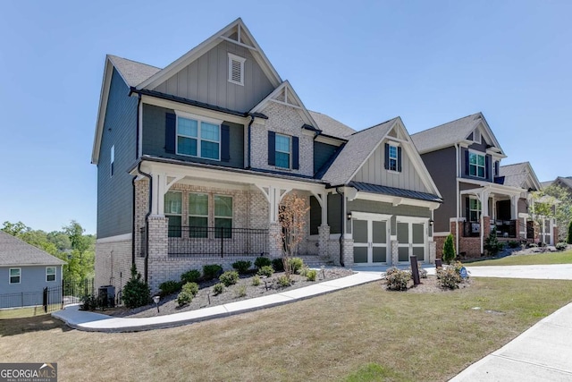 7208 Whitewater Dr, Flowery Branch, GA 30542 - craftsman inspired home with board and batten siding, covered porch, brick siding, and an attached garage