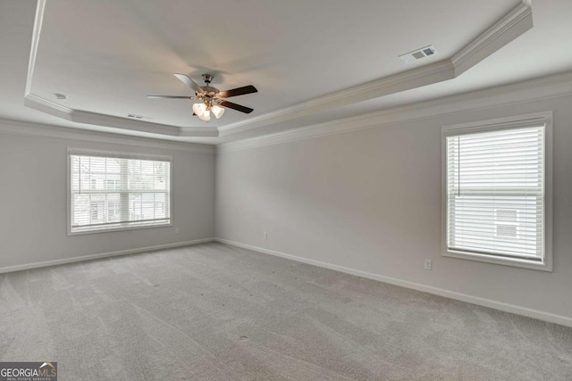 7208 Whitewater Dr, Flowery Branch, GA 30542 - unfurnished room with a tray ceiling, crown molding, ceiling fan, and light colored carpet