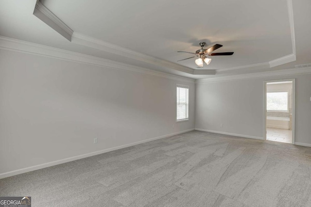 7208 Whitewater Dr, Flowery Branch, GA 30542 - spare room with a raised ceiling, ornamental molding, ceiling fan, and carpet flooring