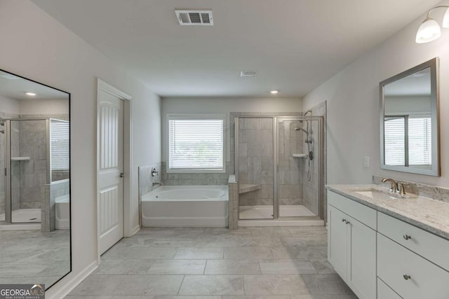 7208 Whitewater Dr, Flowery Branch, GA 30542 - full bathroom with a garden tub, vanity, a stall shower, and recessed lighting