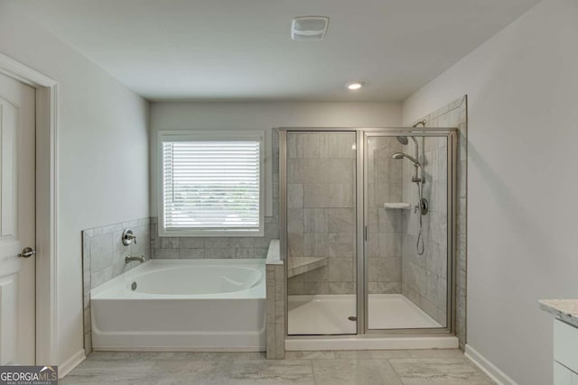 7208 Whitewater Dr, Flowery Branch, GA 30542 - bathroom with a garden tub, a shower stall, and vanity