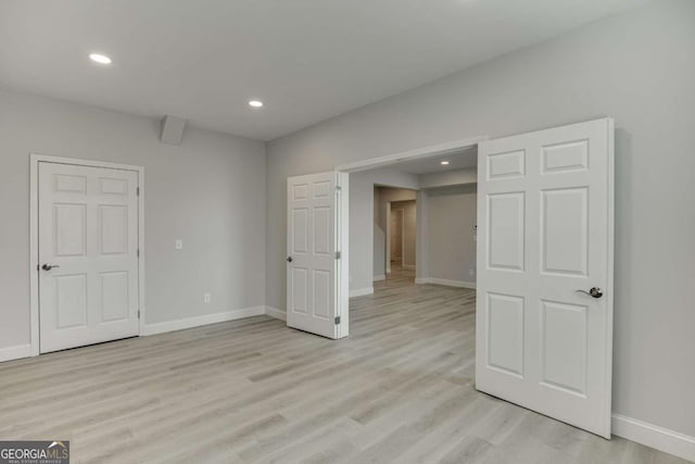 7208 Whitewater Dr, Flowery Branch, GA 30542 - spare room with light wood-style floors and recessed lighting