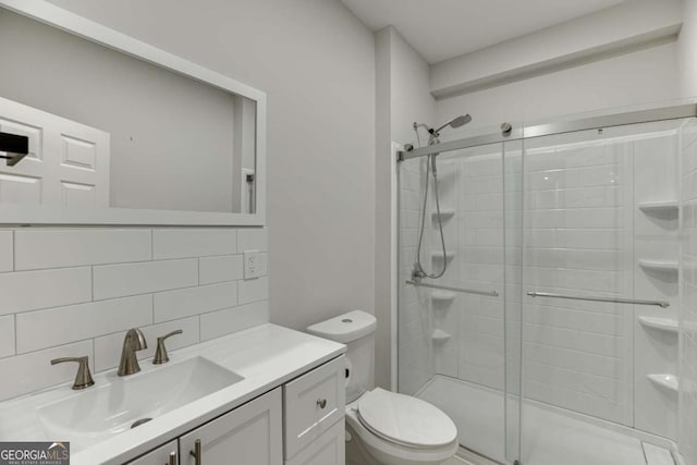 7208 Whitewater Dr, Flowery Branch, GA 30542 - full bath featuring a shower stall, tasteful backsplash, and vanity
